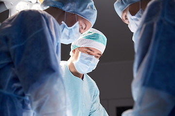 Image showing group of surgeons in operating room at hospital