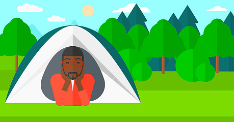 Image showing Man lying in tent.