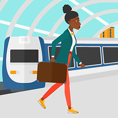 Image showing Woman going out of train.