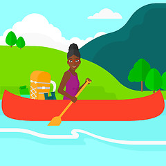 Image showing Woman canoeing on the river.