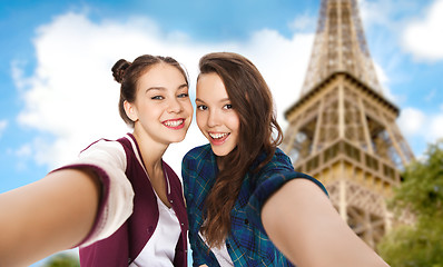 Image showing teenage girls taking selfie over eiffel tower