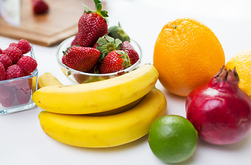 Image showing close up of fresh fruits and berries on table