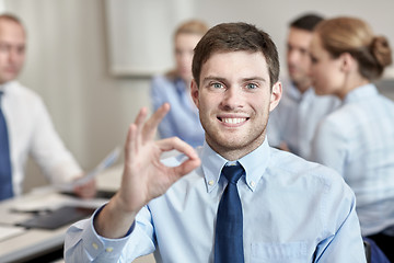 Image showing group of smiling businesspeople meeting in office