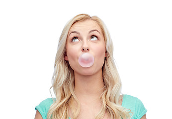 Image showing happy young woman or teenage girl chewing gum