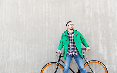 Image showing happy young hipster man with fixed gear bike