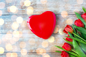 Image showing close up of red tulips and chocolate box