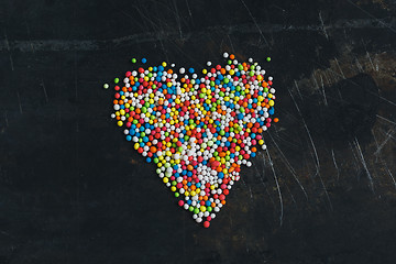 Image showing Colorful Sugar Balls in the form of heart.