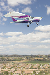 Image showing The Cessna 172 Single Propeller Airplane Flying In Sky