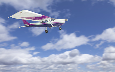 Image showing The Cessna 172 Single Propeller Airplane Flying In Sky