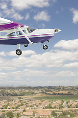 Image showing The Cessna 172 Single Propeller Airplane Flying In Sky