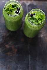 Image showing Two green smoothie in the jar