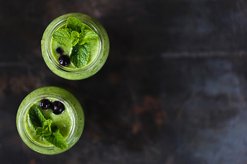 Image showing Two green smoothie in the jar