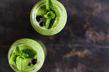 Image showing Two green smoothie in the jar