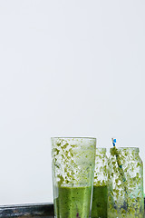 Image showing empty glasses of green smoothie