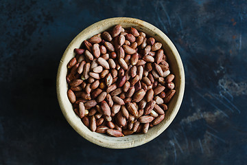 Image showing Roasted peanuts in wooden bowl