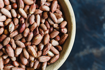 Image showing Roasted peanuts in wooden bowl