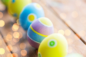 Image showing close up of colored easter eggs on wooden surface