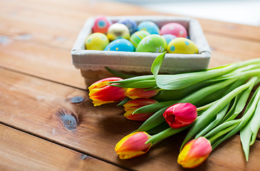 Image showing close up of colored easter eggs and flowers