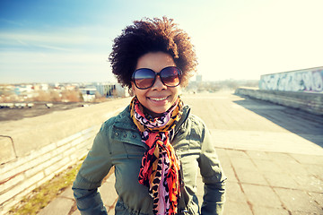 Image showing happy african american woman in shades on street