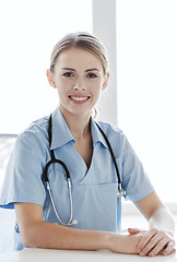 Image showing happy doctor or nurse with clipboard at hospital