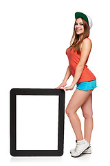 Image showing Teen funky girl standing with a frame