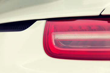 Image showing close up of car part with grille and headlight