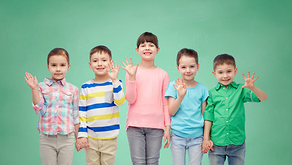 Image showing happy smiling little children holding hands