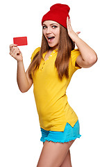 Image showing Surprised teen funky girl with credit card