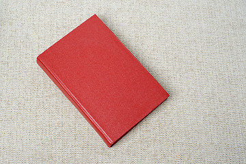 Image showing Red book on the sofa