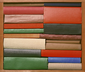 Image showing Old books on wooden brown shelf