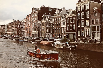 Image showing AMSTERDAM, THE NETHERLANDS - AUGUST 18, 2015: Street life and ty