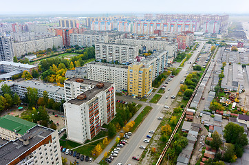 Image showing Aerial view on city street, houses and garages