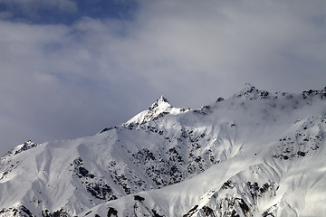 Image showing Sunlight mountain peak and cloudy sky in evening