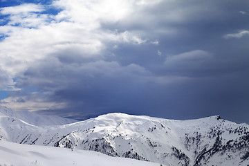 Image showing Sunlight slope and cloudy gray sky in evening