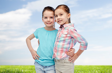 Image showing happy smiling little girls hugging