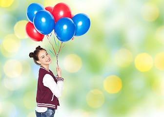 Image showing happy teenage girl with helium balloons