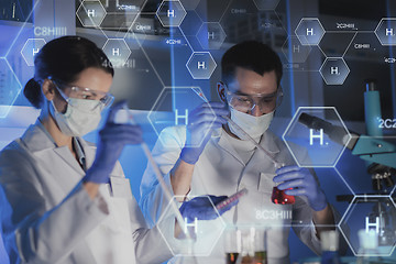 Image showing close up of scientists making test in lab