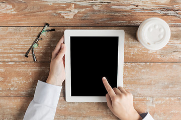 Image showing close up of female hands with tablet pc and coffee