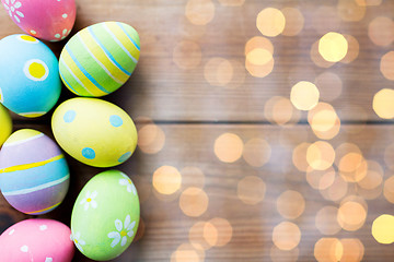 Image showing close up of colored easter eggs on wooden surface