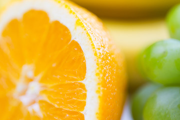 Image showing close up of fresh juicy orange and grape