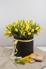 Image showing Bright spring bouquet of tulips and mimosa flowers