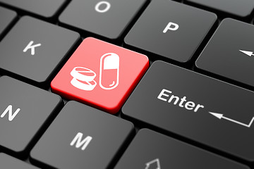 Image showing Medicine concept: Pills on computer keyboard background