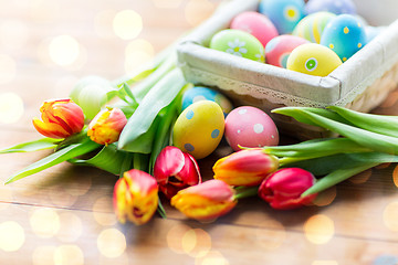 Image showing close up of colored easter eggs and flowers