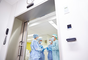 Image showing group of surgeons in operating room at hospital