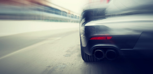 Image showing close up of car riding on highway from back