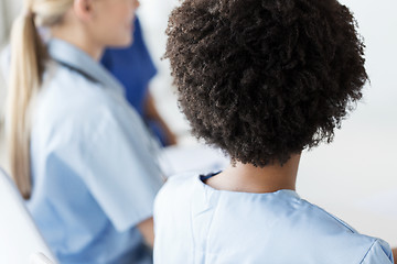 Image showing close up of african doctor at hospital from back