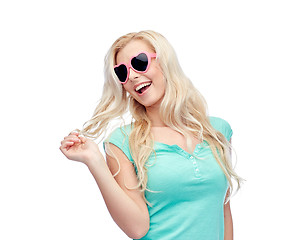 Image showing happy young blonde woman or teenager in sunglasses