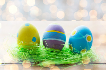 Image showing close up of colored easter eggs and grass