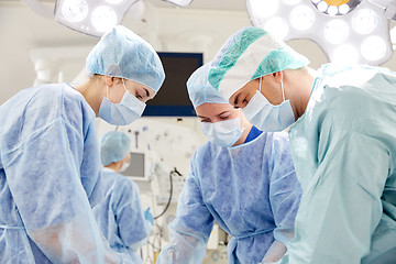 Image showing group of surgeons in operating room at hospital