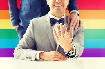 Image showing close up of male gay couple with wedding rings on